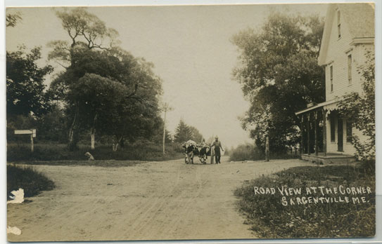This appears to be George Jordan with his team of oxen approaching the corner of Reach Road and Caterpillar Hill .
