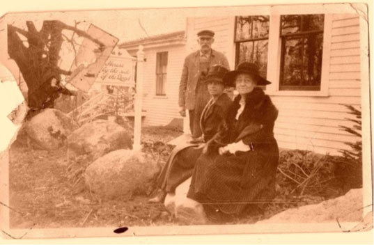 Miss Sally Eugenia Brown is with her cook and Albert Billings in front of “The House By the Side of the Road”.
