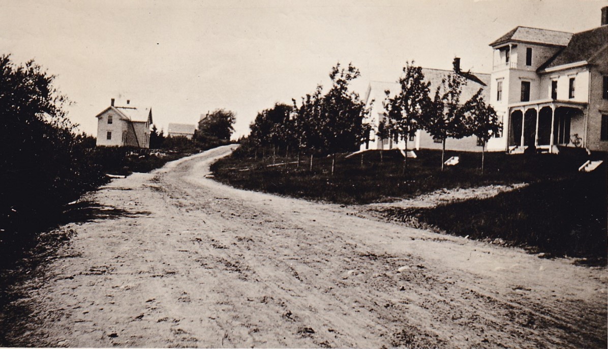 The house on the left of Rodolph’s house belonged to Benjamin C. Sargent.  Abby Sargent wrote that both Sargent houses were built in about 1884.[1] The house across the road belonged to Jennie Beedle. Diane and Eric Kornmeier now own Rodolph’s house and have put considerable effort into making improvements while maintaining its classic design.
