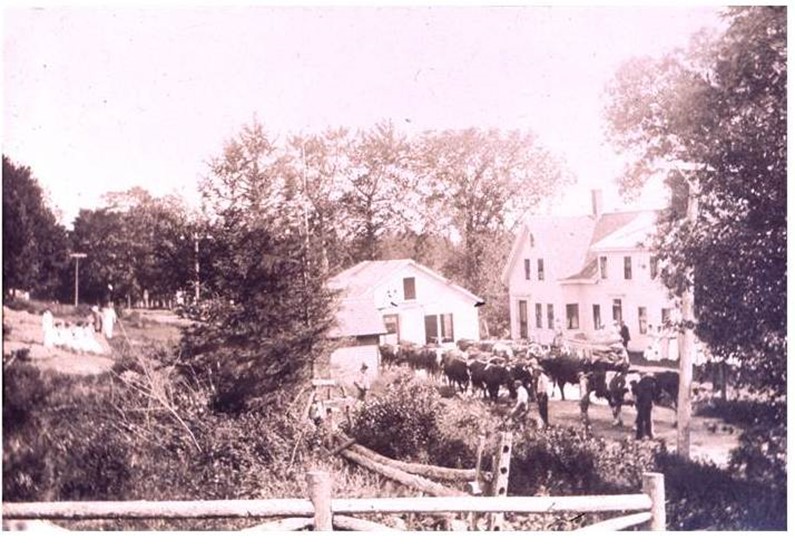 In this photo the building is now moving past Parker Billings home on the right with the front yard of Rock Hill, on the left.  Also, on the left, you can see the well house that stood next to the road, in front of Rock Hill. It is said that Parker Billings got his water from that well.  Sadly, Parker and Sarah Billings’ house burned “flat to the ground” in 1947.