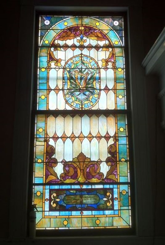 One of the beautiful stained glass windows in the First Baptist Church.  This one was donated by Deacon Daniel Morgan and John Means. Photo by David Anderson.