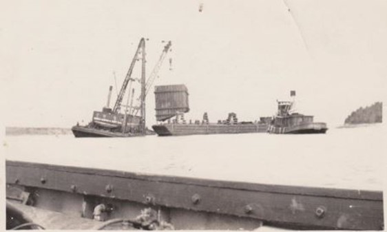 The Monarch lifting a coffer dam from a barge. It then would be lowered into place.