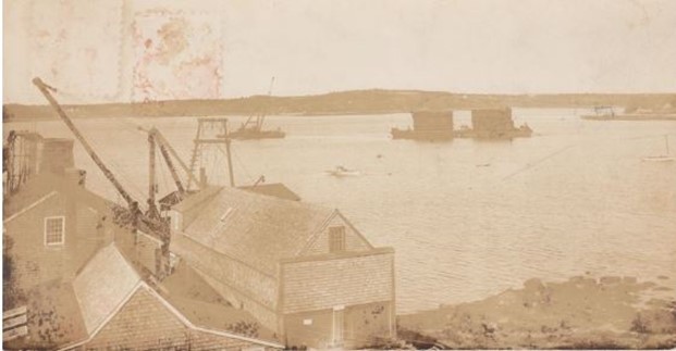Barges with the prefabricated coffer-dams that became part of the base of the bridge.