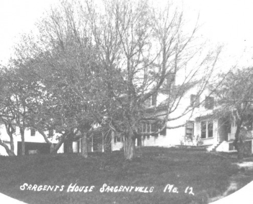 The Sargent House became an inn. At the left you can see the livery stable and part of the Jasper Sargent Store which stood between the Simmons and Sargent houses.