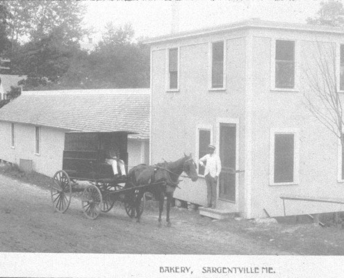 The bakery (right) and bowling alley (left) built over the brook next to Gigi and Joe Gray’s home.