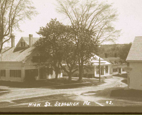 The center building is R.M. Buckminster’s store where Traveler’s Home once stood.