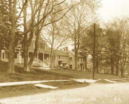 Street scene in Sedgwick village showing the Cavendish House and sidewalks