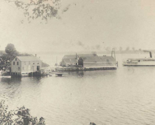 A steamboat leaving the wharf.