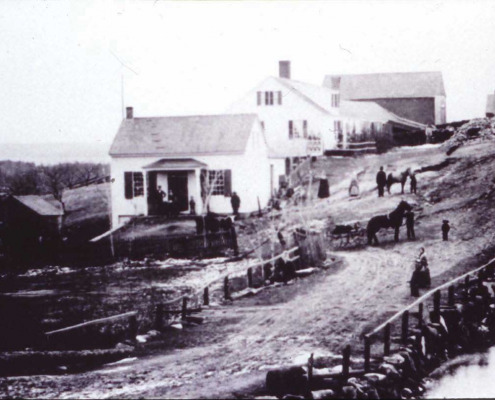Wyer G. Sargent moved here from Birchland (currently Brooklin) where his father had settled and built this home in 1837. The small building in front was his first store. This was the center of Sargentville village at the time as shown in the 1859 photo. The store was later moved across the road and is now part of Butch Gray’s property.