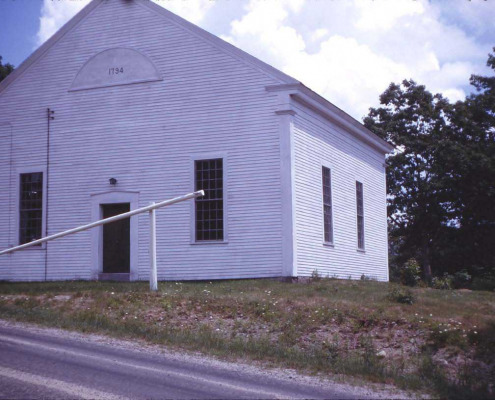 The first church built in 1789 stood east of the Benjamin River. The second, built in 1794, was cut down in size (so it wasn’t so tall) and serves today as our Town House.