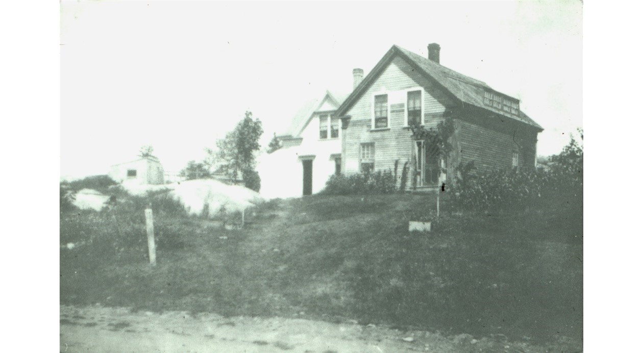 This is an early photo of the Starkey home. It is believed that the left section of the building was built by Wyer G. Sargent in 1847 and used as a meeting room, called Rio Hall, for the Sons of Temperance Rio Grande Division No. 63.  It is also said that Andrew Cooper had a blacksmith shop on the first floor and that at least a portion of this house was moved here from Lazy Corner.
