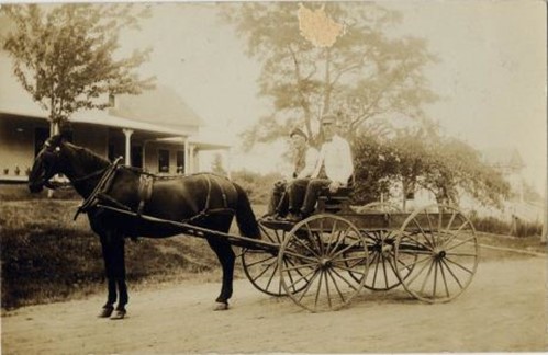 Azor Dodge (L) and George Grindal. The Sargentville Library is in the background on the right.