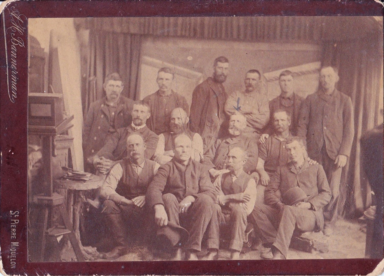 The crew of either the Amelia Cobb or the We’re Here with Captain Edward A. Byard in the center (with the arrow)